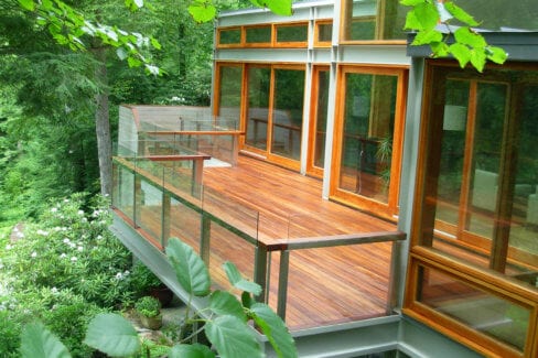 Stained IPE Deck with glass Railings in Pound Ridge, NY